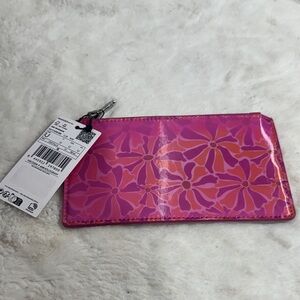 MNG Mango Iridescent cosmetics bag featuring a floral print and a zip fastening